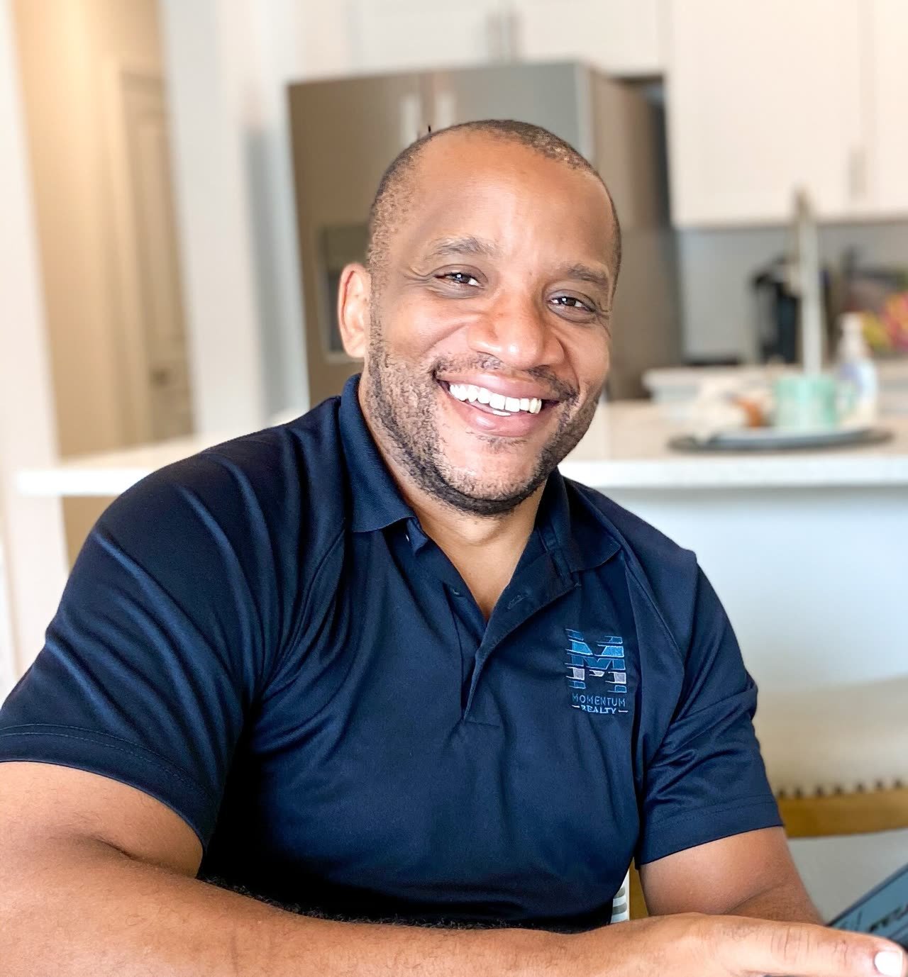 Chris Moore of We Buy Any House In Florida at the kitchen table